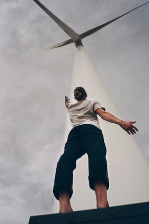 person and wind power plant